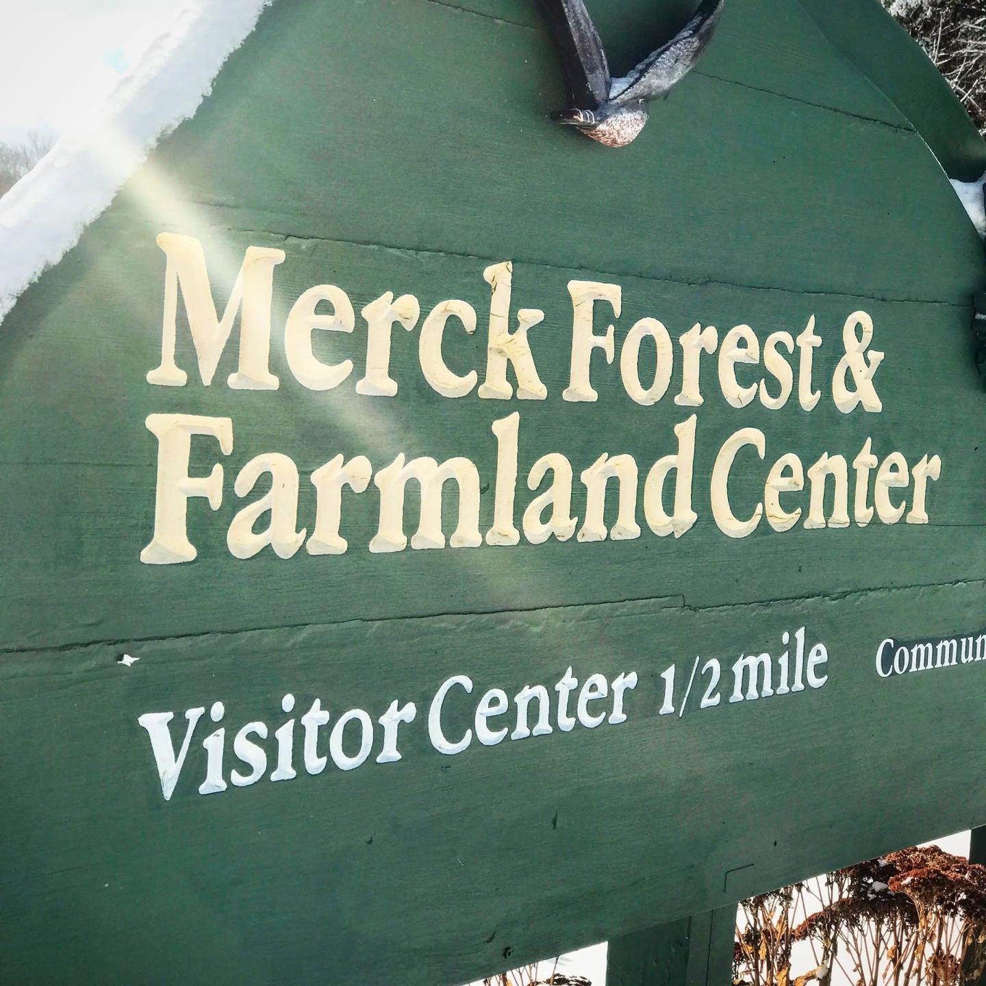Merck Forest &amp; Farmland Center, Visitor Center 1/2 mile sign with sunlight flare.